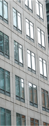 Structured office facade representing organisational scale