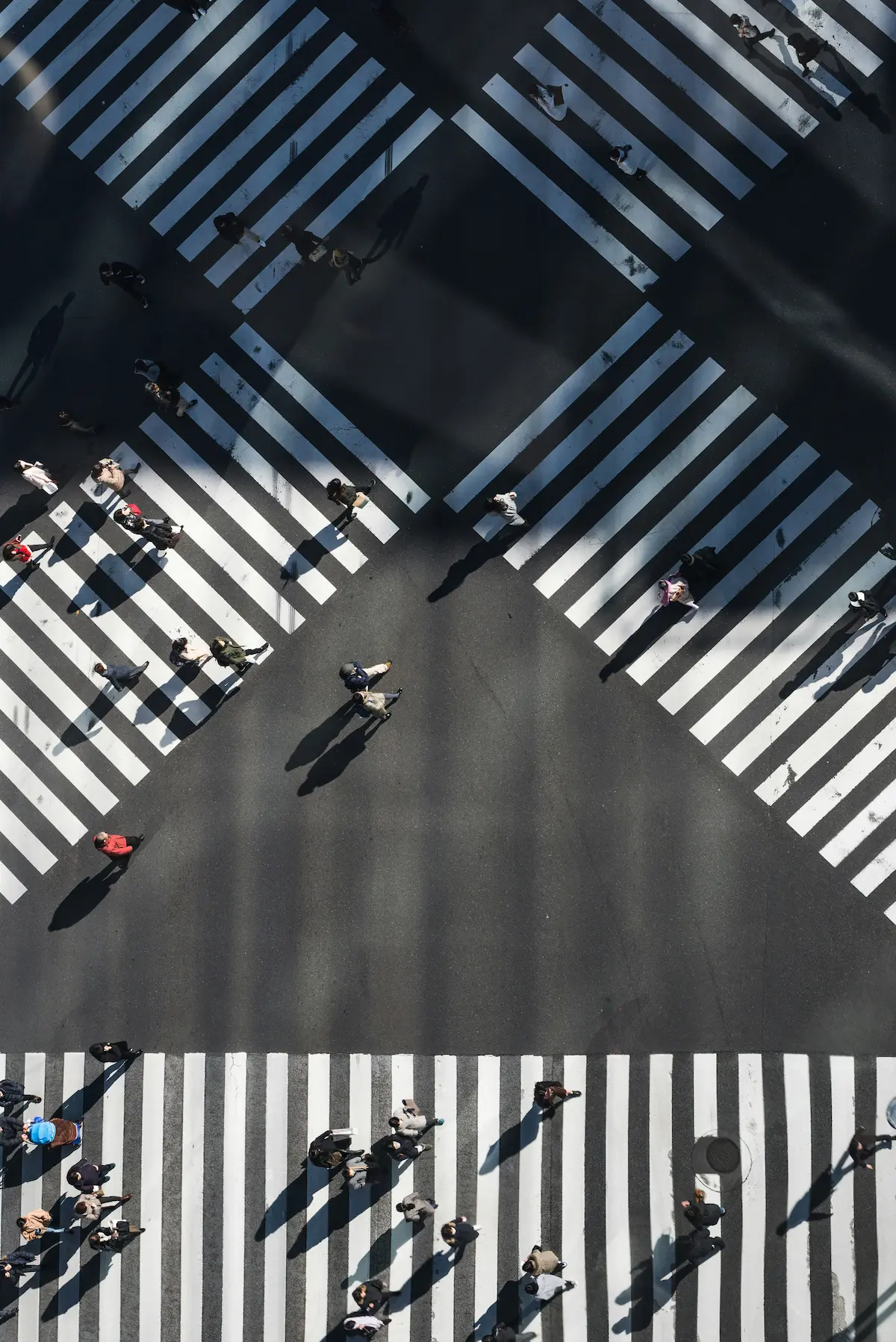 Aerial view of a crosswalk with people walking