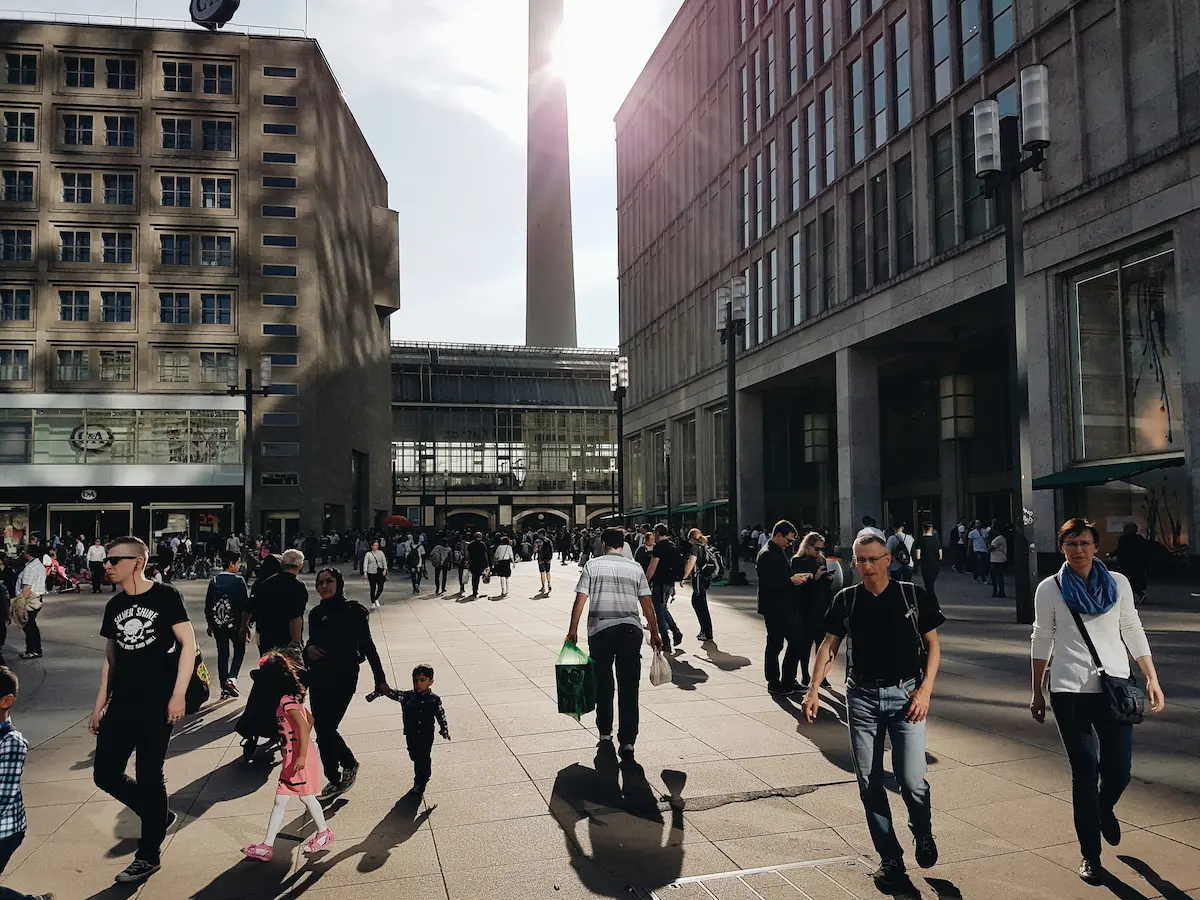Street scene with people walking between buildings