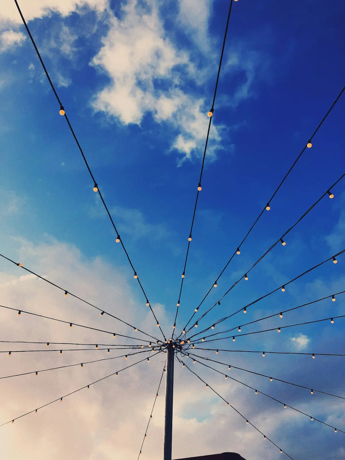 Lights against a sky with clouds